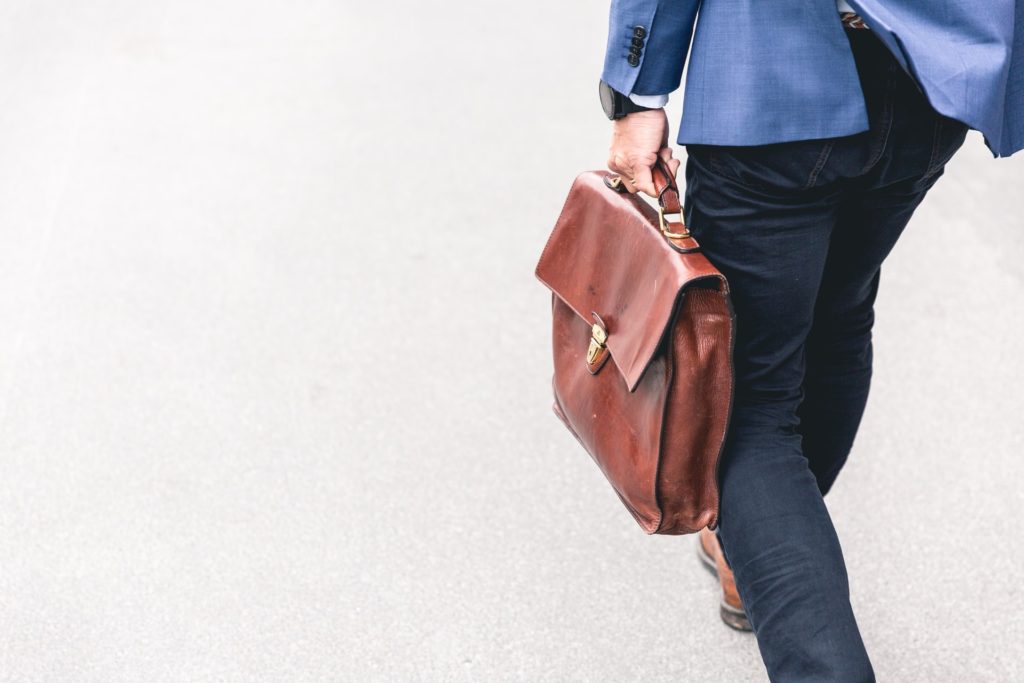 businessman carrying a satchel