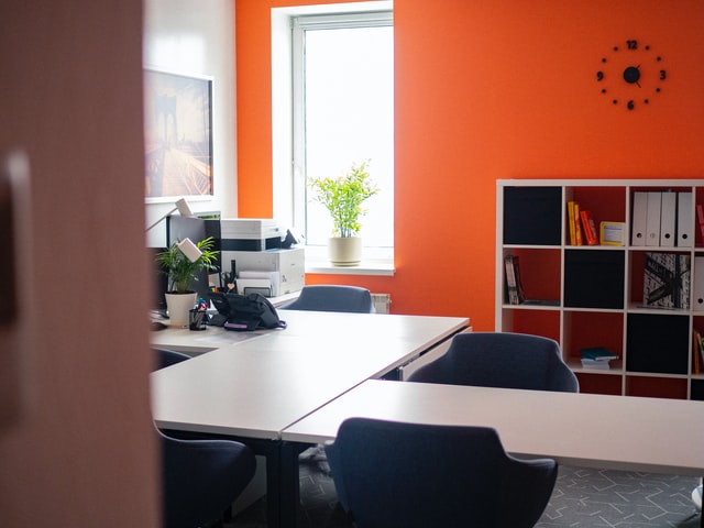 empty office with bright orange accent wall