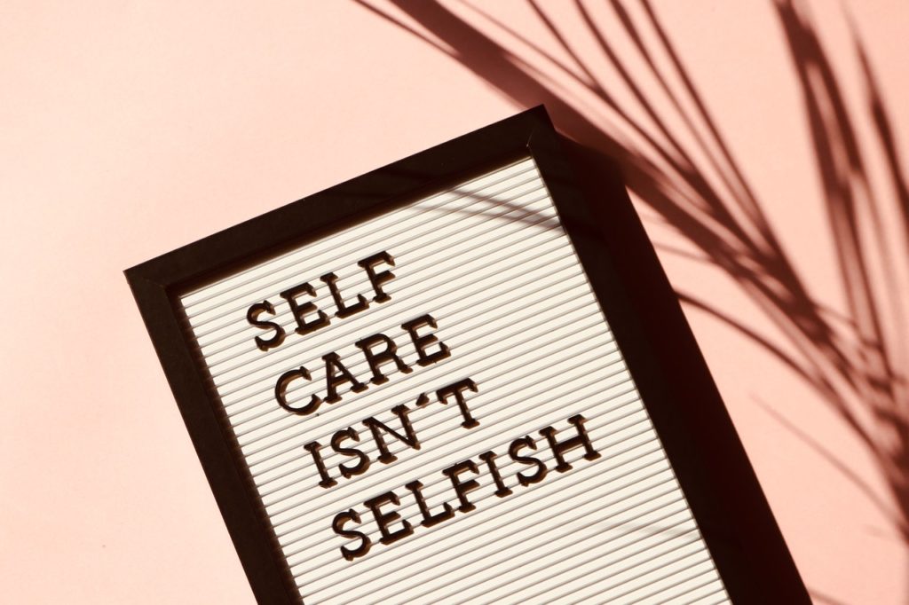 self care isn't selfish letters on mood board for mental health awareness