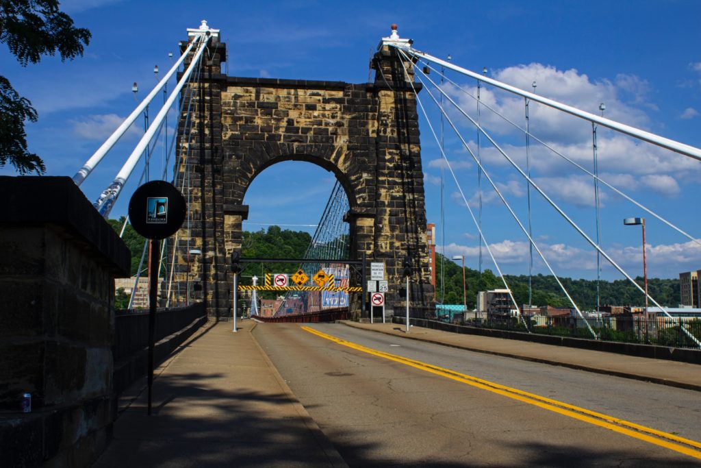 a bridge arc with ongoing construction and warning signs in a city in west virginia