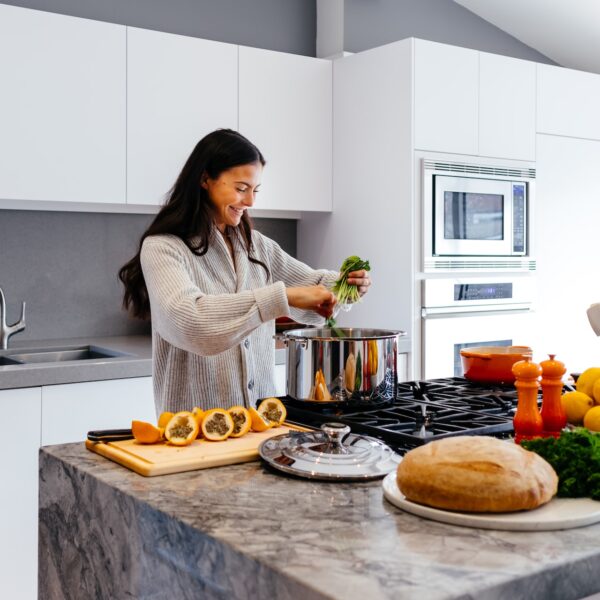 Woman preparing a healthy meal in her kitchen