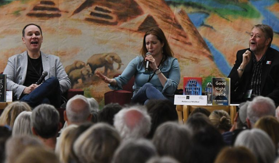 Authors reading on stage at the festival of books