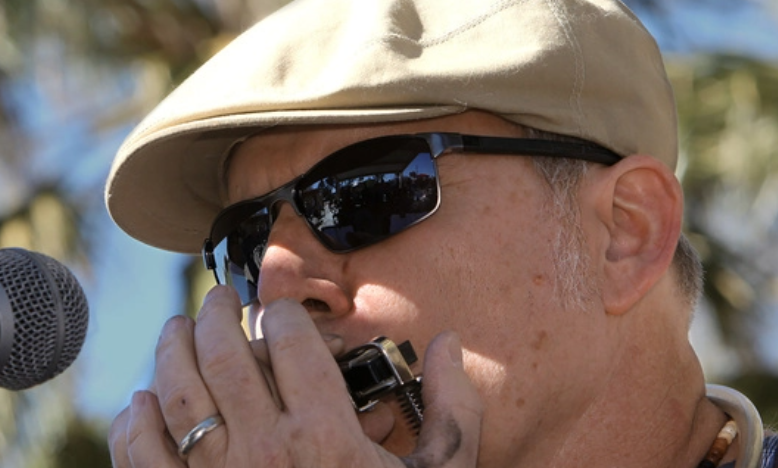 Man playing a harmonica