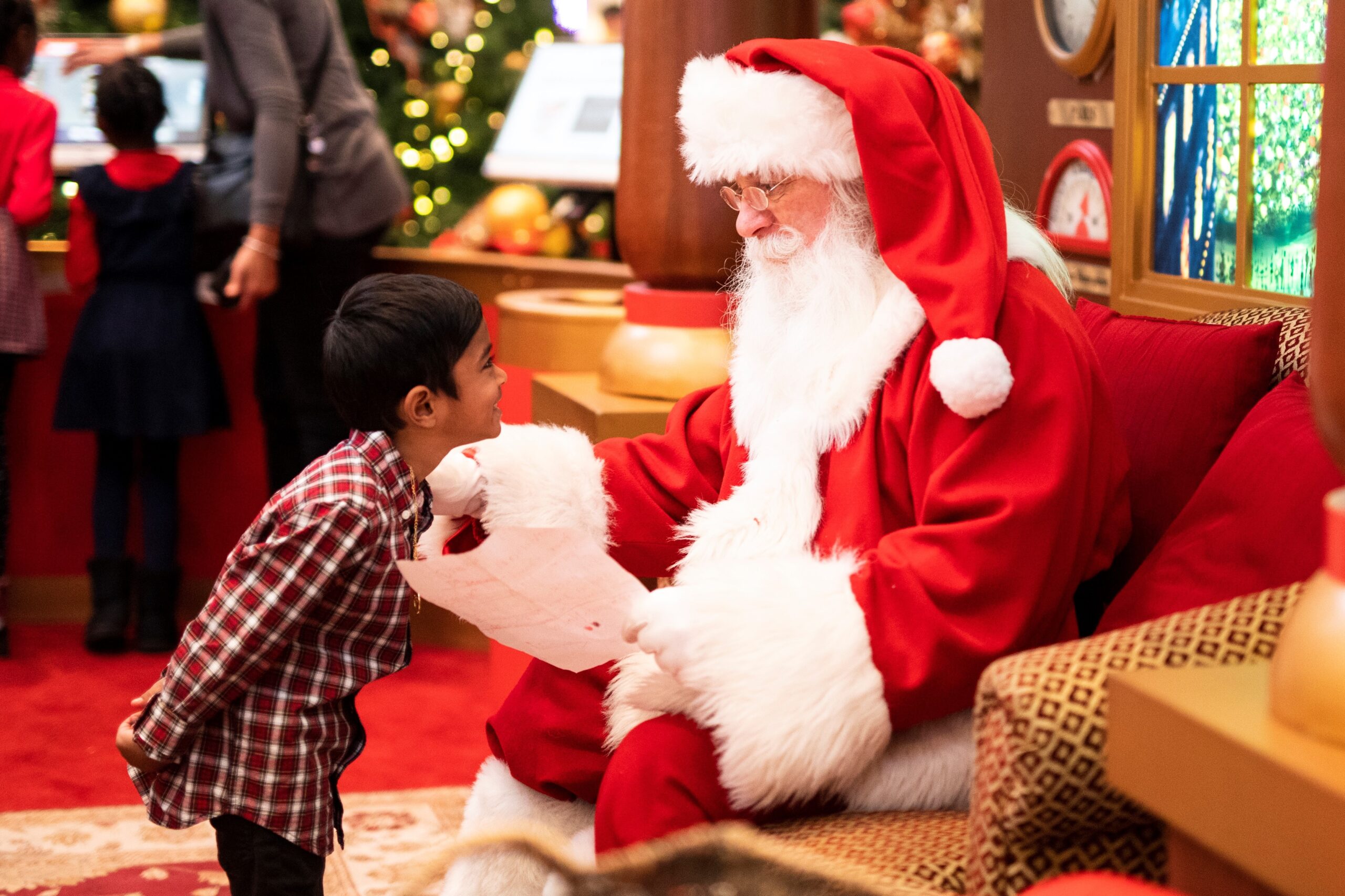 Santa interacting with young child