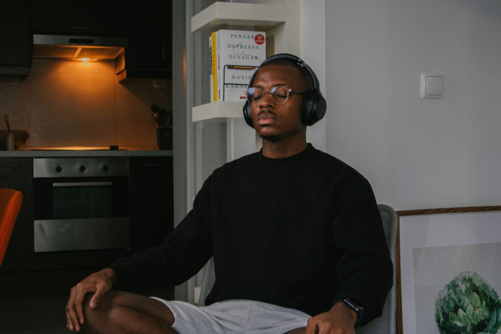man meditating with headphones
