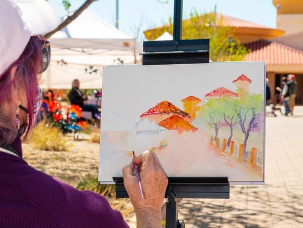 Woman painting at the art on the lake event