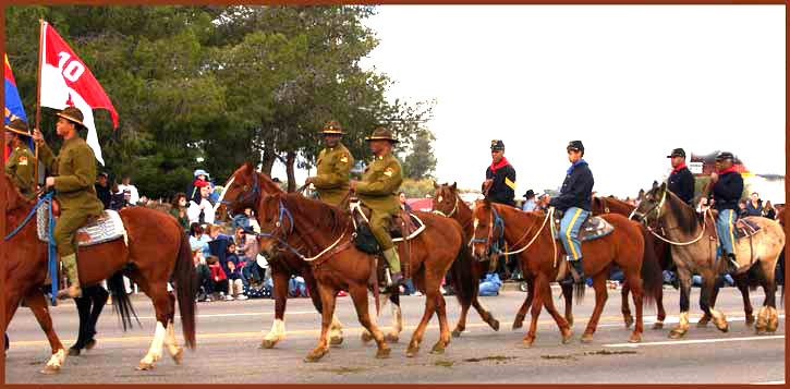 Parade of people riding horses