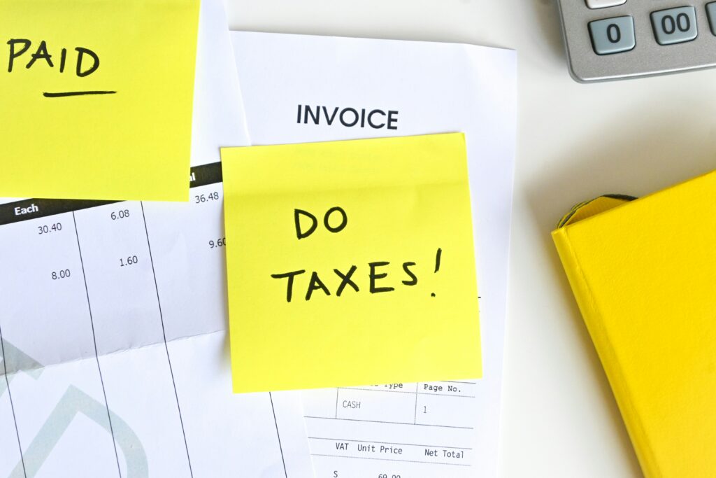 Yellow sticky note that says "do taxes"